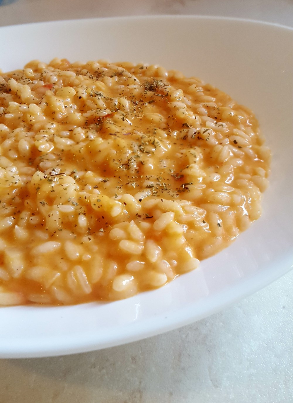 Risotto pomodoro, stracchino e origano